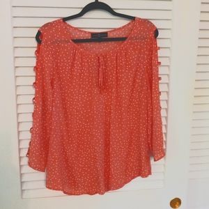 Open arm polka-dot coral blouse